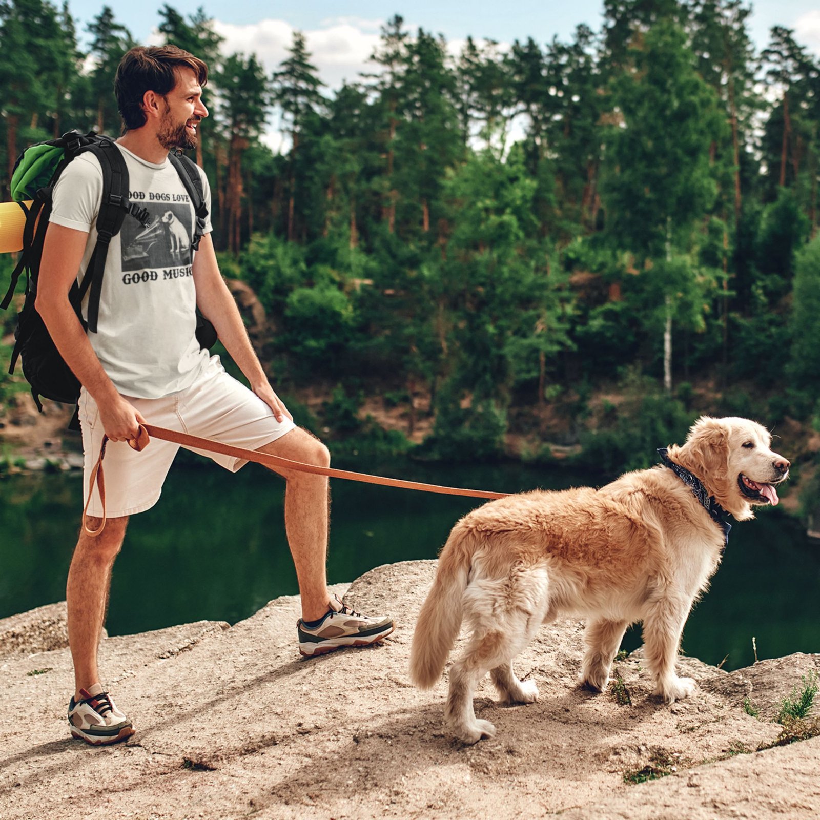 Man wearing Frontier Rogue Good Dogs Love Good Music graphic tee with dog in outdoor setting