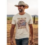 Man in Cowboy Hat wearing Frontier Rogue Go All In Always graphic tee in outdoor western setting