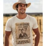 Man wearing Frontier Rogue Jesse James Wanted Poster graphic tee in outdoor setting
