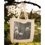 Frontier Rogue Wildflowers Tote Bag hanging from tree