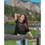 Man wearing Frontier Rogue Brown Logo Tee in Black in Nature