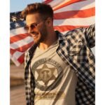 Man wearing Frontier Rogue Wild Bill Hickok western tee with American flag
