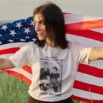Woman wearing Frontier Rogue No Trends No Fake Followers Just Heart tee with American flag