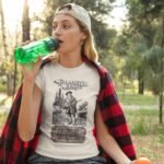 Woman wearing Frontier Rogue Calamity Jane graphic tee in outdoor setting