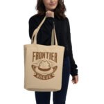 Frontier Rogue logo tote bag held by woman
